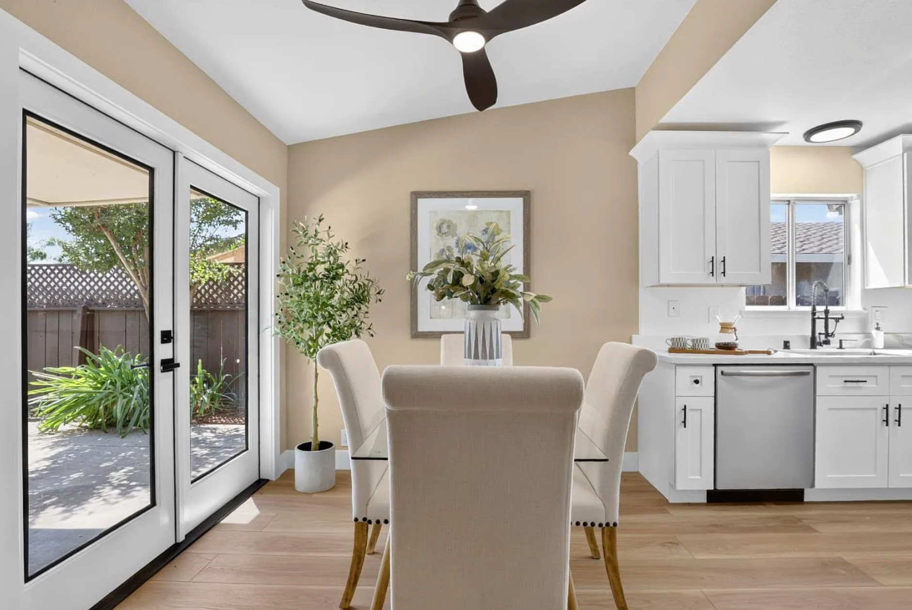 Finished dining area beside the renovated kitchen and garden doors